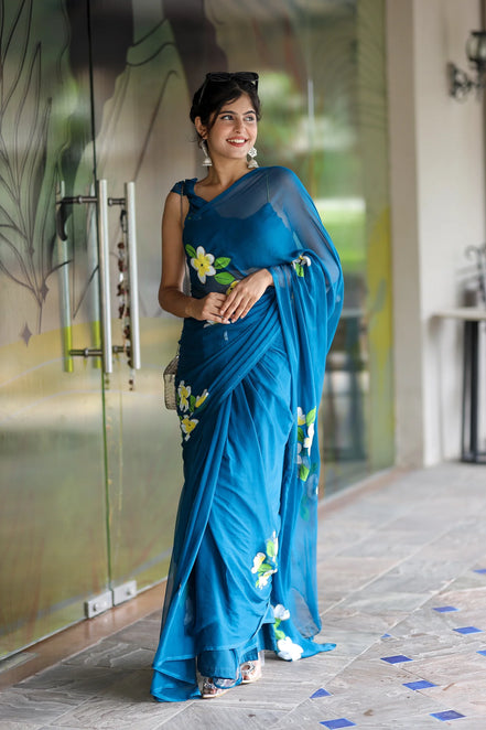 Nayantara Blue Chiffon Hand-Painted Saree – Frangipani Florals & Breezy Elegance