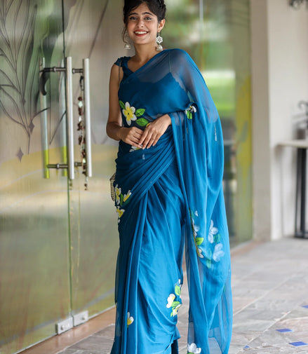 Nayantara Blue Chiffon Hand-Painted Saree – Frangipani Florals & Breezy Elegance