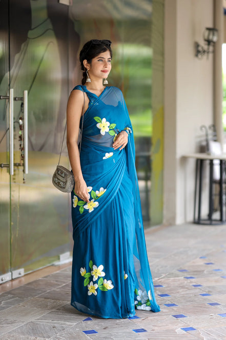 Nayantara Blue Chiffon Hand-Painted Saree – Frangipani Florals & Breezy Elegance