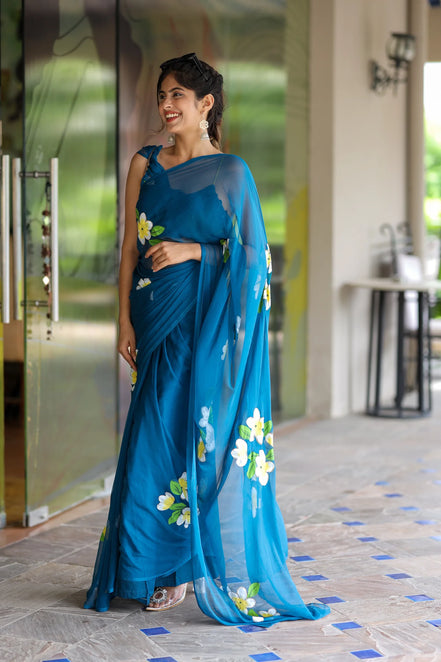 Nayantara Blue Chiffon Hand-Painted Saree – Frangipani Florals & Breezy Elegance