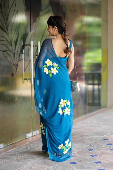 Nayantara Blue Chiffon Hand-Painted Saree – Frangipani Florals & Breezy Elegance