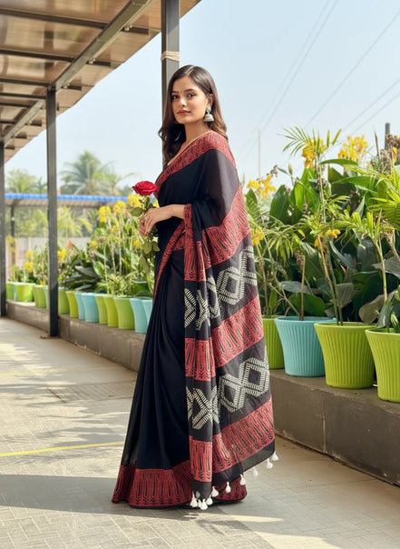 "Bhairavi" - Black Mulmul Cotton Saree with Red Border