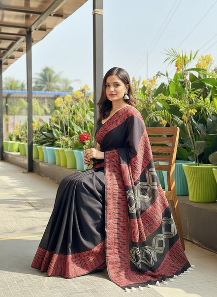 "Bhairavi" - Black Mulmul Cotton Saree with Red Border