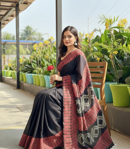 "Bhairavi" - Black Mulmul Cotton Saree with Red Border