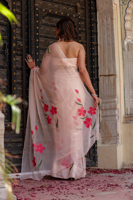 Iravya Peach Chiffon Saree – Hand-Painted Hibiscus Poetry