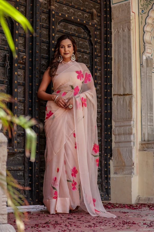 Iravya Peach Chiffon Saree – Hand-Painted Hibiscus Poetry