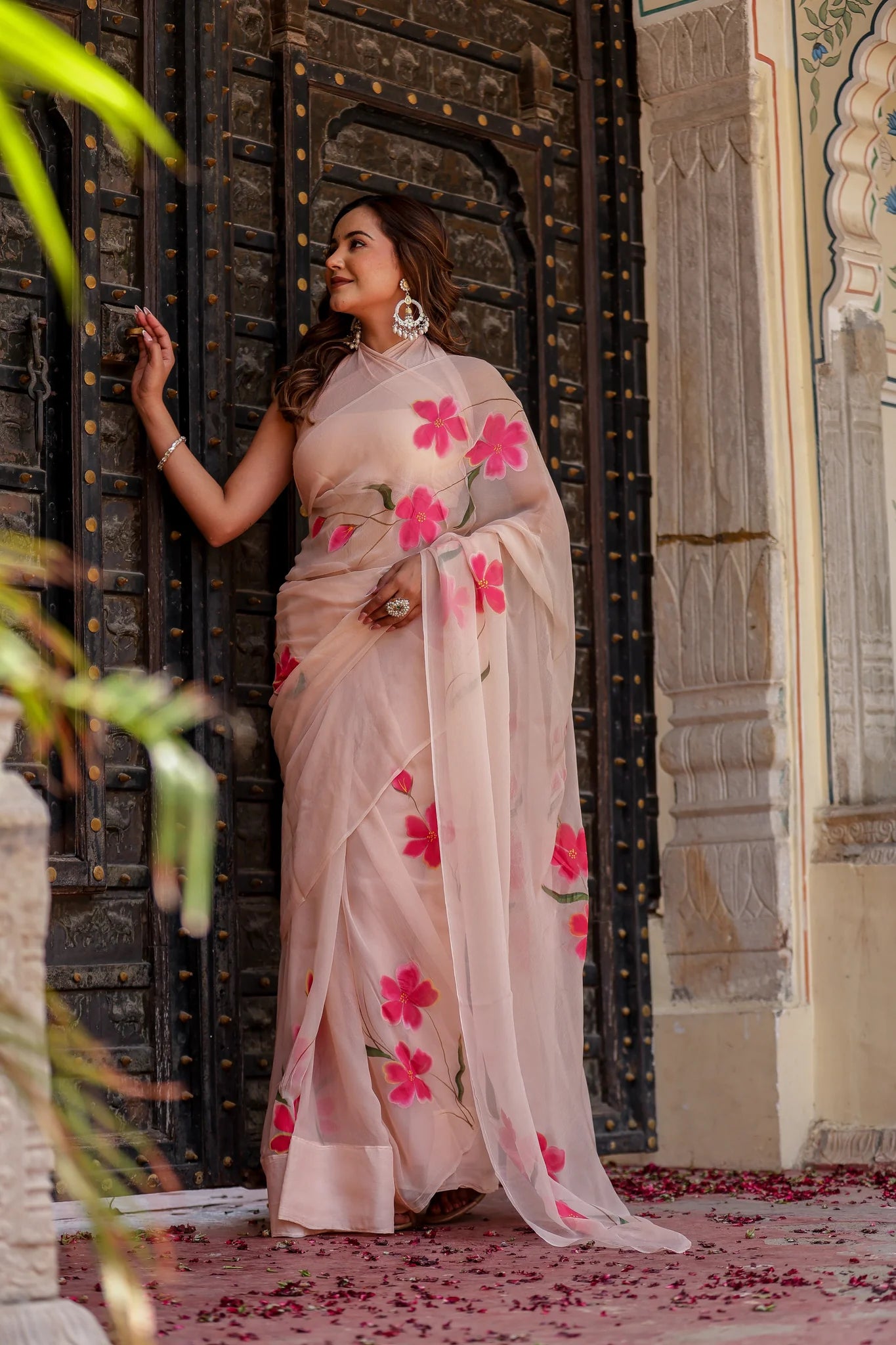 Iravya Peach Chiffon Saree – Hand-Painted Hibiscus Poetry