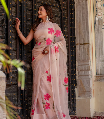 Iravya Peach Chiffon Saree – Hand-Painted Hibiscus Poetry