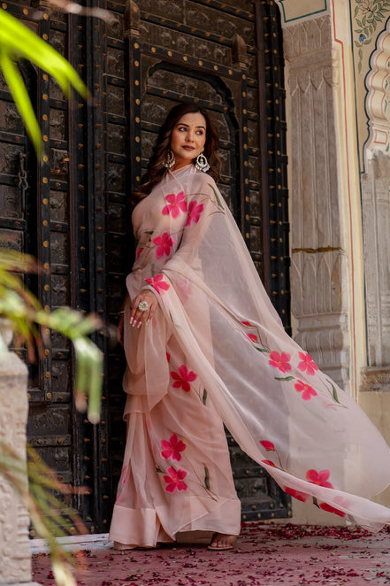 Iravya Peach Chiffon Saree – Hand-Painted Hibiscus Poetry