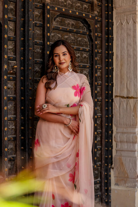 Iravya Peach Chiffon Saree – Hand-Painted Hibiscus Poetry