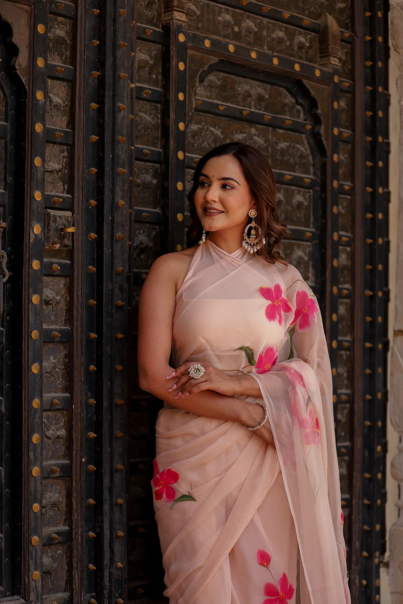 Iravya Peach Chiffon Saree – Hand-Painted Hibiscus Poetry