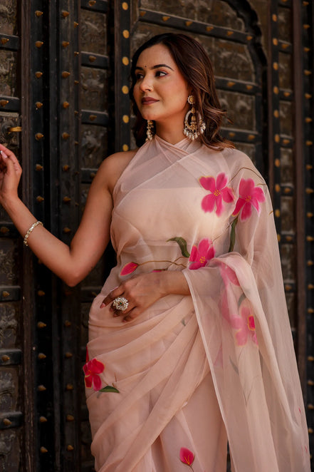 Iravya Peach Chiffon Saree – Hand-Painted Hibiscus Poetry