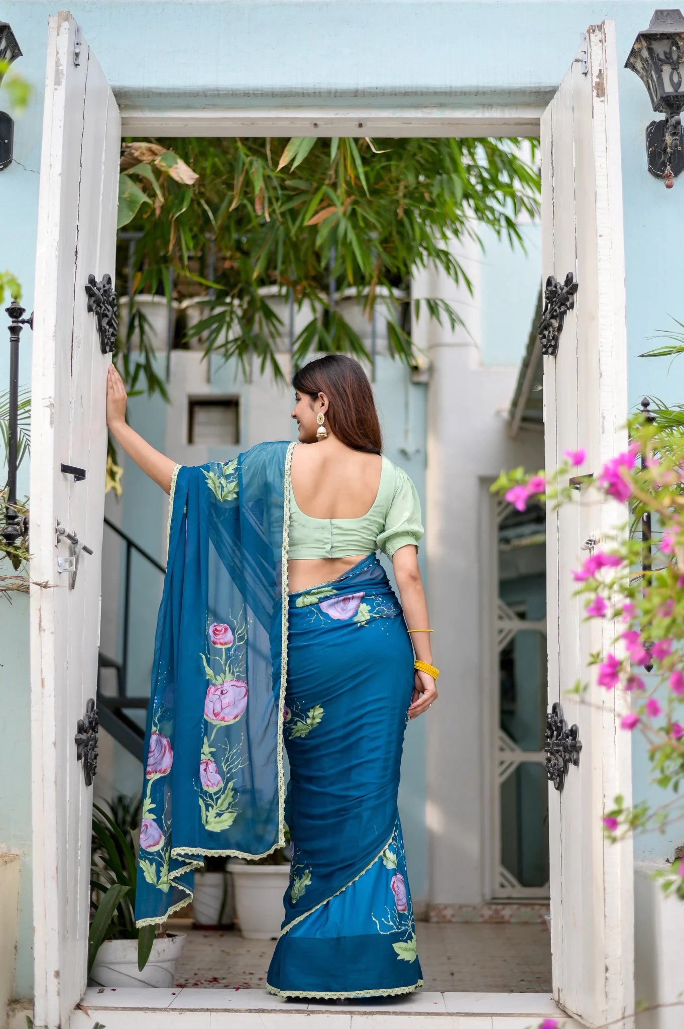 Rajvika Teal Blue Chiffon Saree – Hand-Painted Rose Whisper