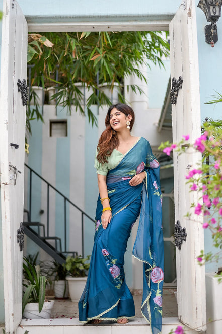 Rajvika Teal Blue Chiffon Saree – Hand-Painted Rose Whisper