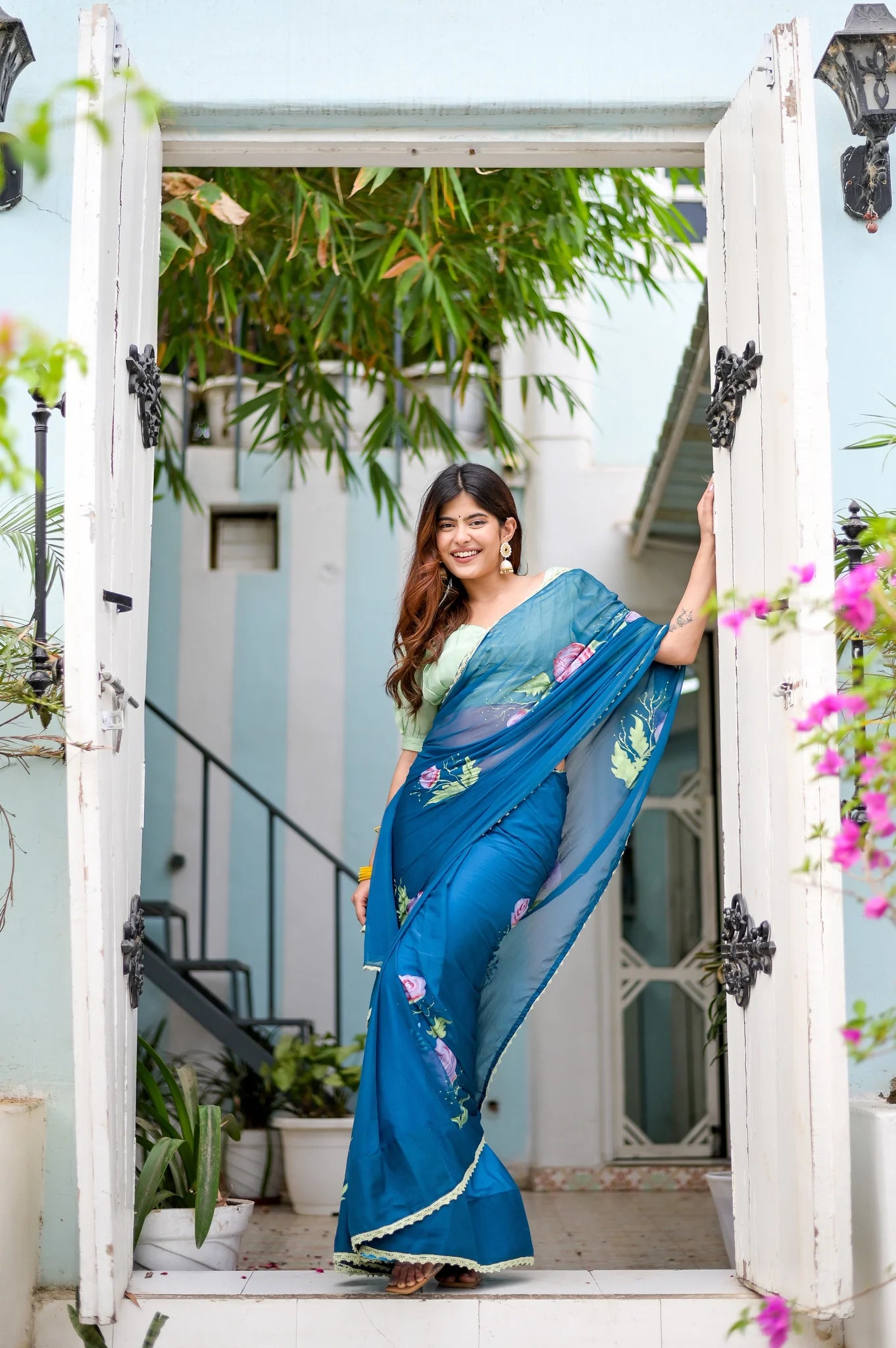 Rajvika Teal Blue Chiffon Saree – Hand-Painted Rose Whisper