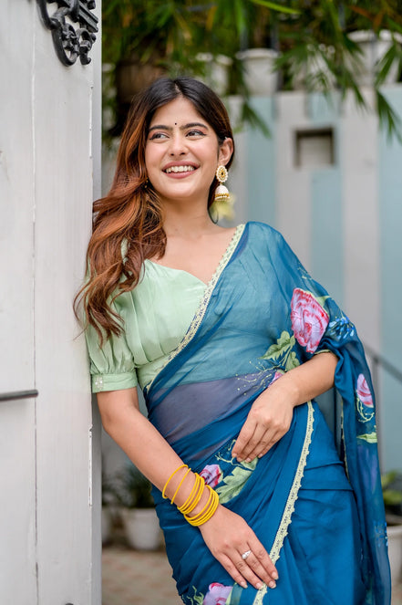 Rajvika Teal Blue Chiffon Saree – Hand-Painted Rose Whisper