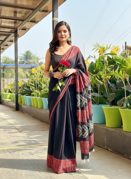 "Bhairavi" - Black Mulmul Cotton Saree with Red Border