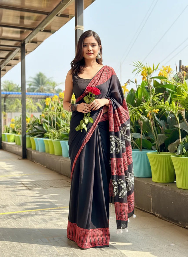 "Bhairavi" - Black Mulmul Cotton Saree with Red Border