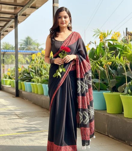 "Bhairavi" - Black Mulmul Cotton Saree with Red Border